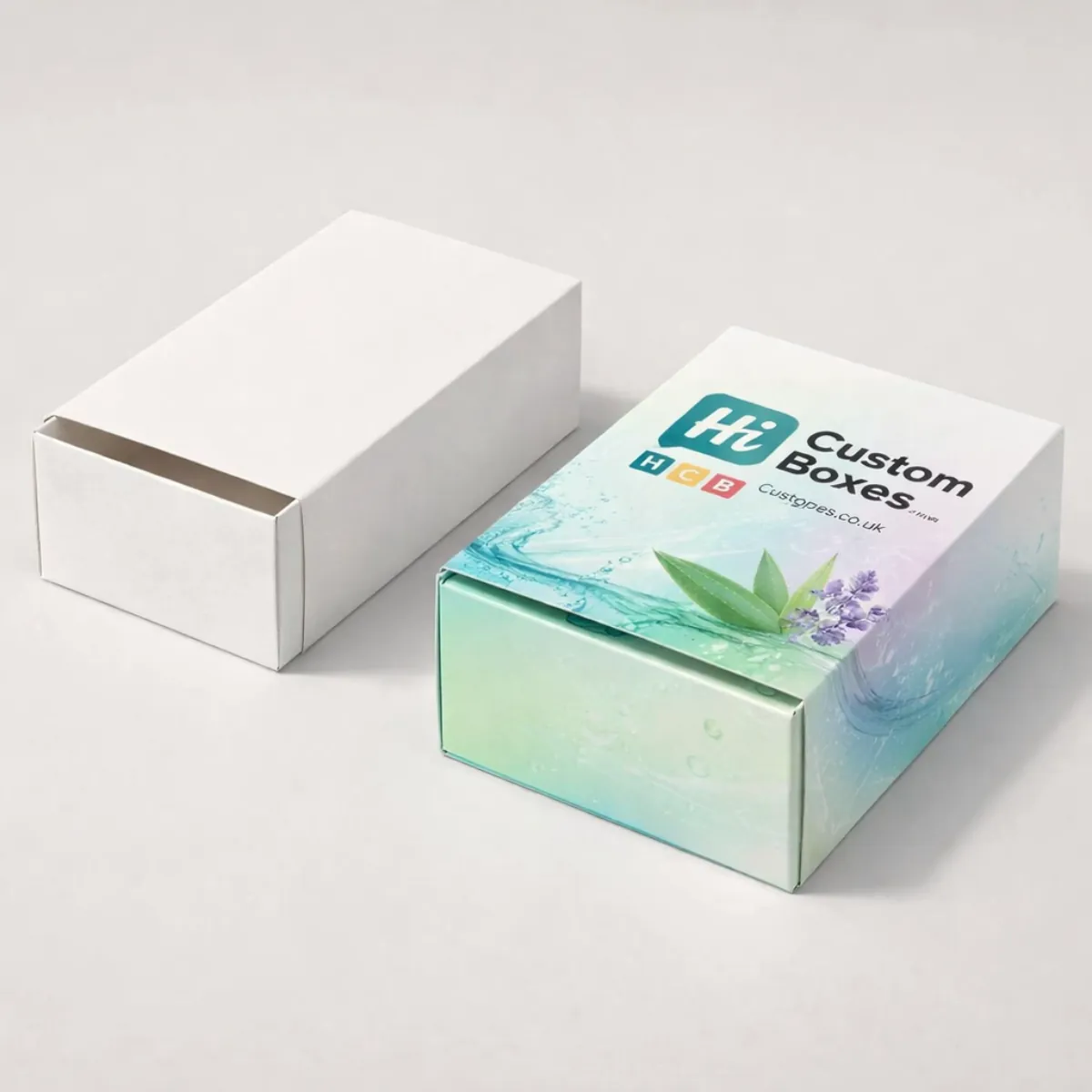 Two sliding drawer-style boxes, one plain white and one with lavender and water-wave botanical printed designs. class=